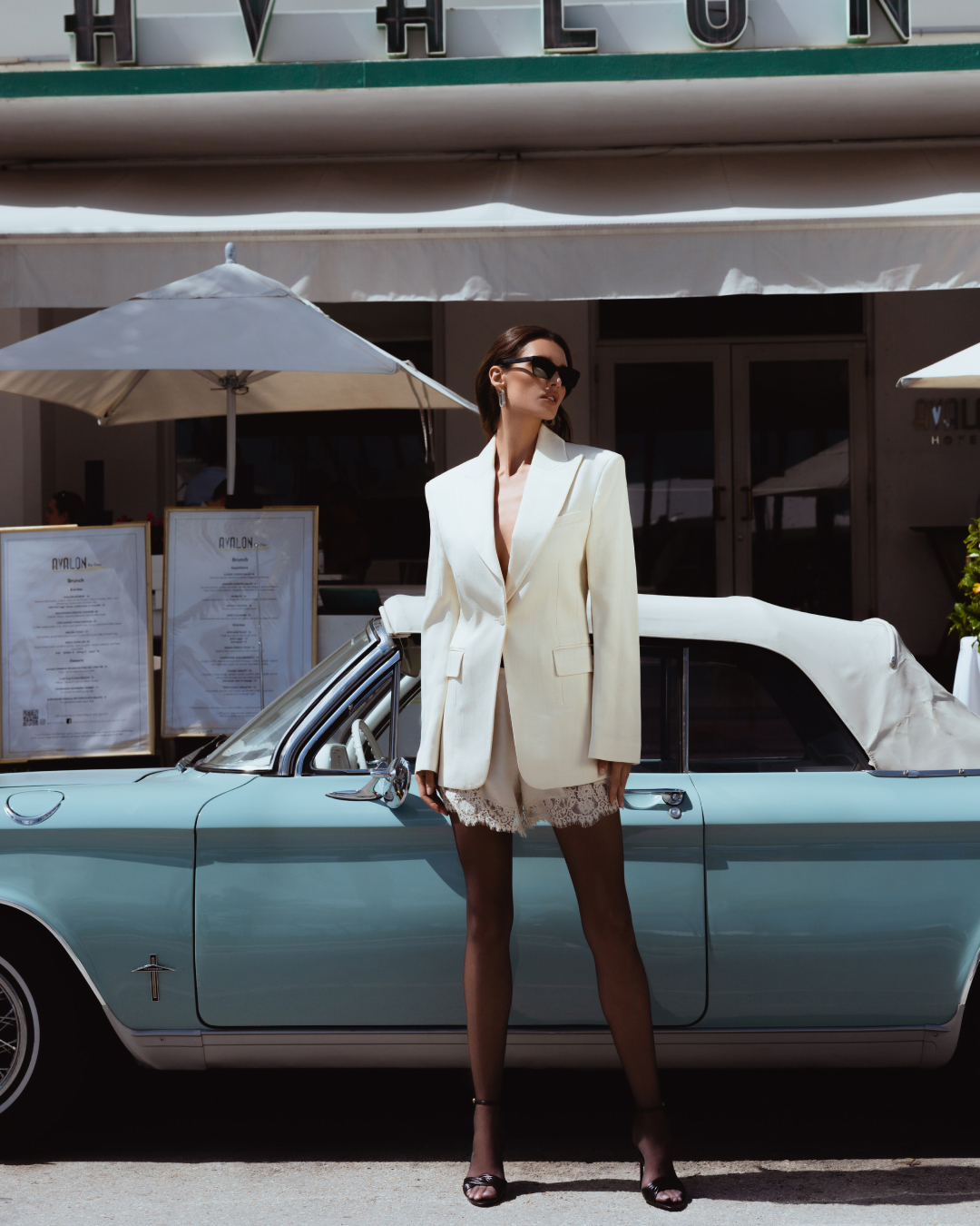 Street fashion look in front of a classic car